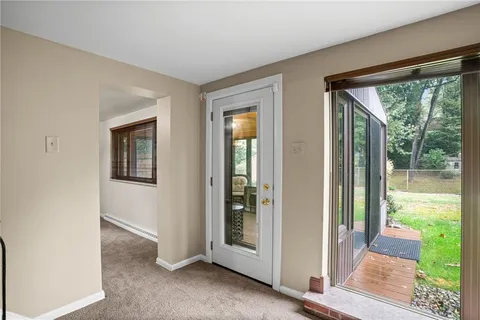 a view of a room that has a large window