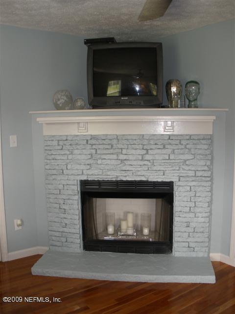 2442 Dean Road Jacksonville, FL 32216 - Photo 5 of 15 a living room with a fireplace