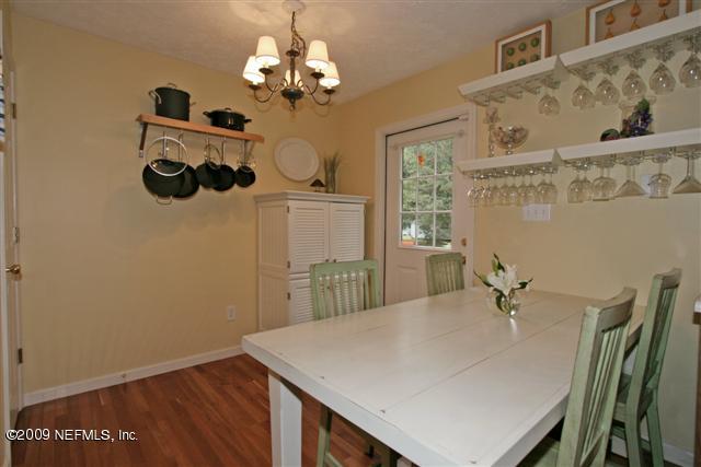 2442 Dean Road Jacksonville, FL 32216 - Photo 8 of 15 a view of a dining room with a table and chairs