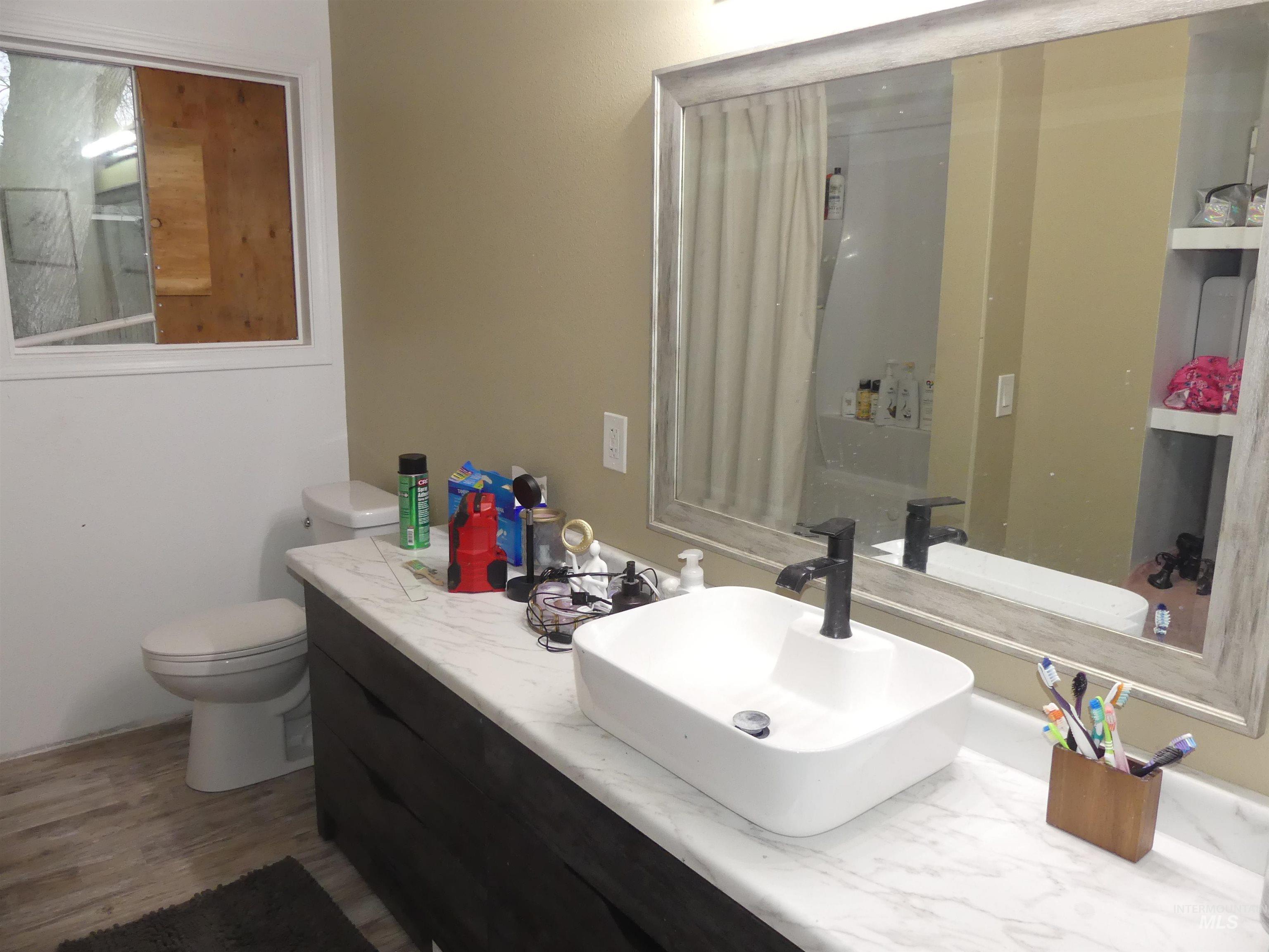 3427 18th Street Lewiston, ID 83501 - Photo 29 of 45 Full bath featuring vanity and dark wood-style flooring