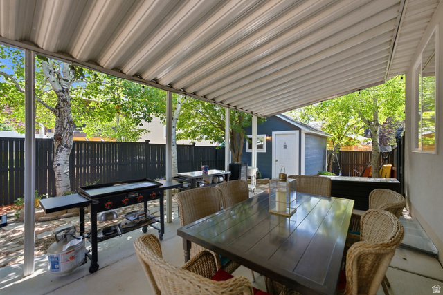 5196 Rodeo Circle Oakley, UT 84055 - Photo 41 of 57 Covered patio area featuring a corrugated metal roof and concrete flooring