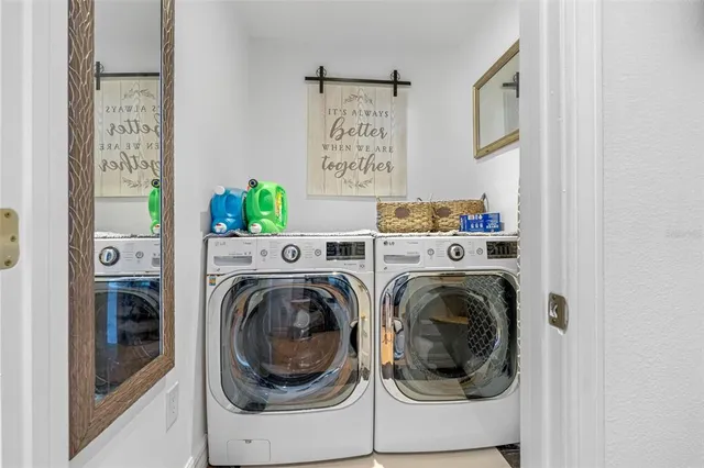 a utility room with dryer and washer