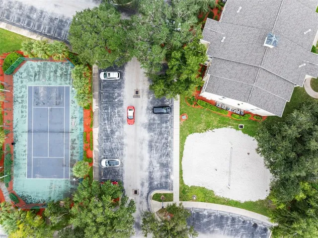 a front view of a house with a garden and plants