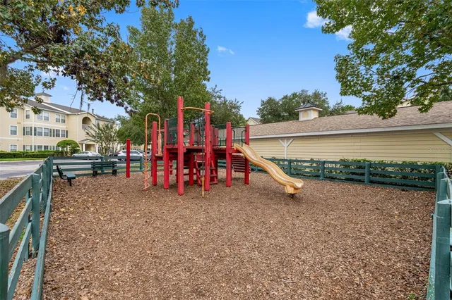 a view of a park with large trees