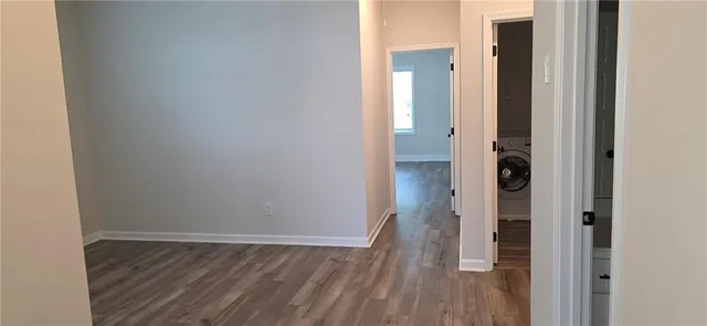 a view of a bathroom with wooden floor