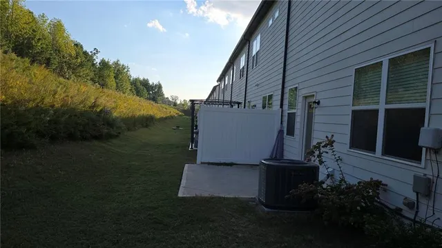 a view of a backyard with potted plants