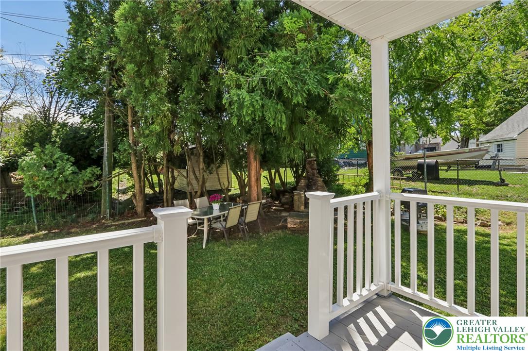 974 Juniper Road Hellertown, PA 18055 - Photo 31 of 48 Enjoy the private, well-maintained yard featuring an outdoor patio area with a table for al fresco dining.