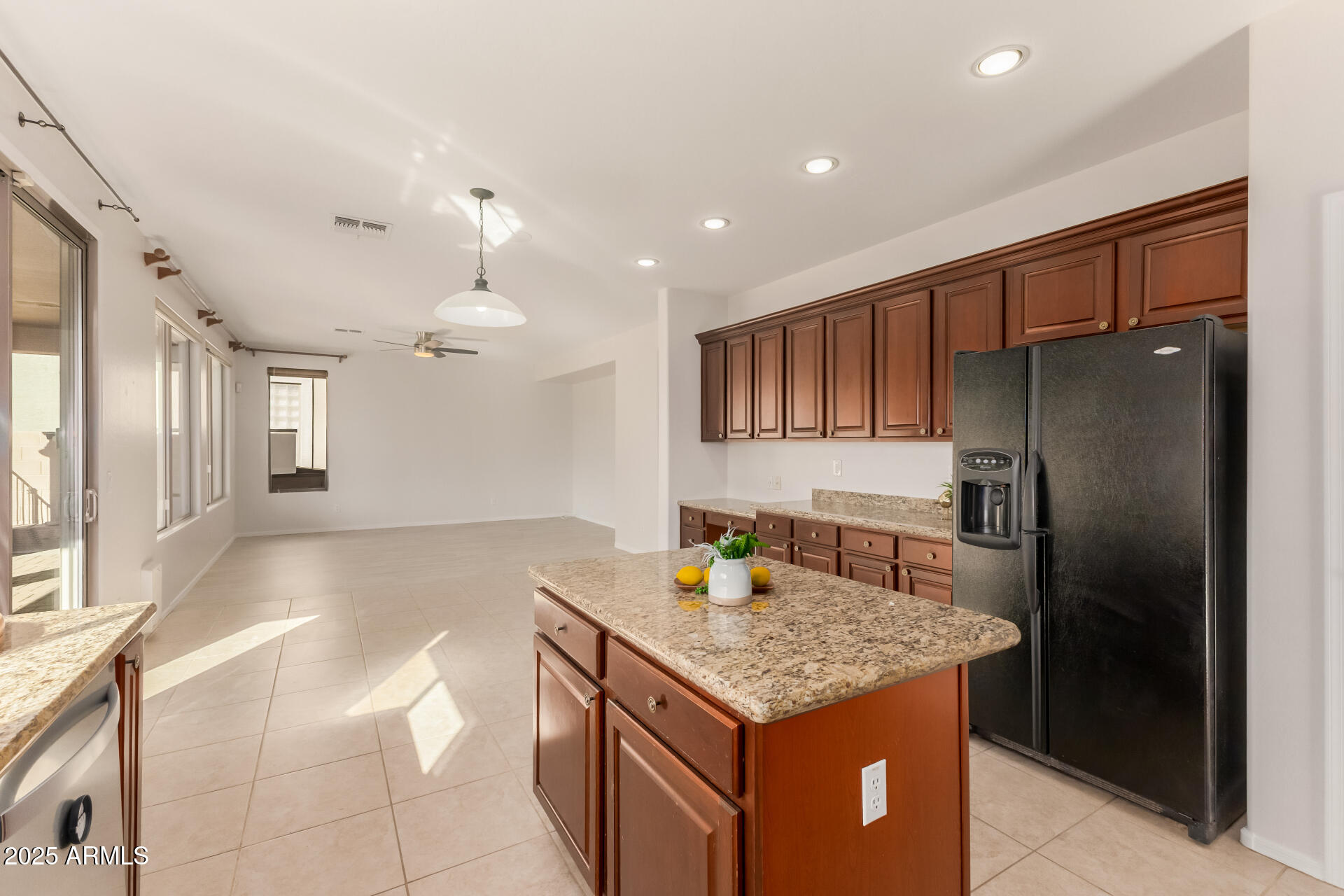 35822 North 33rd Lane Phoenix, AZ 85086 - Photo 17 of 54 a kitchen with kitchen island a counter top space cabinets and stainless steel appliances