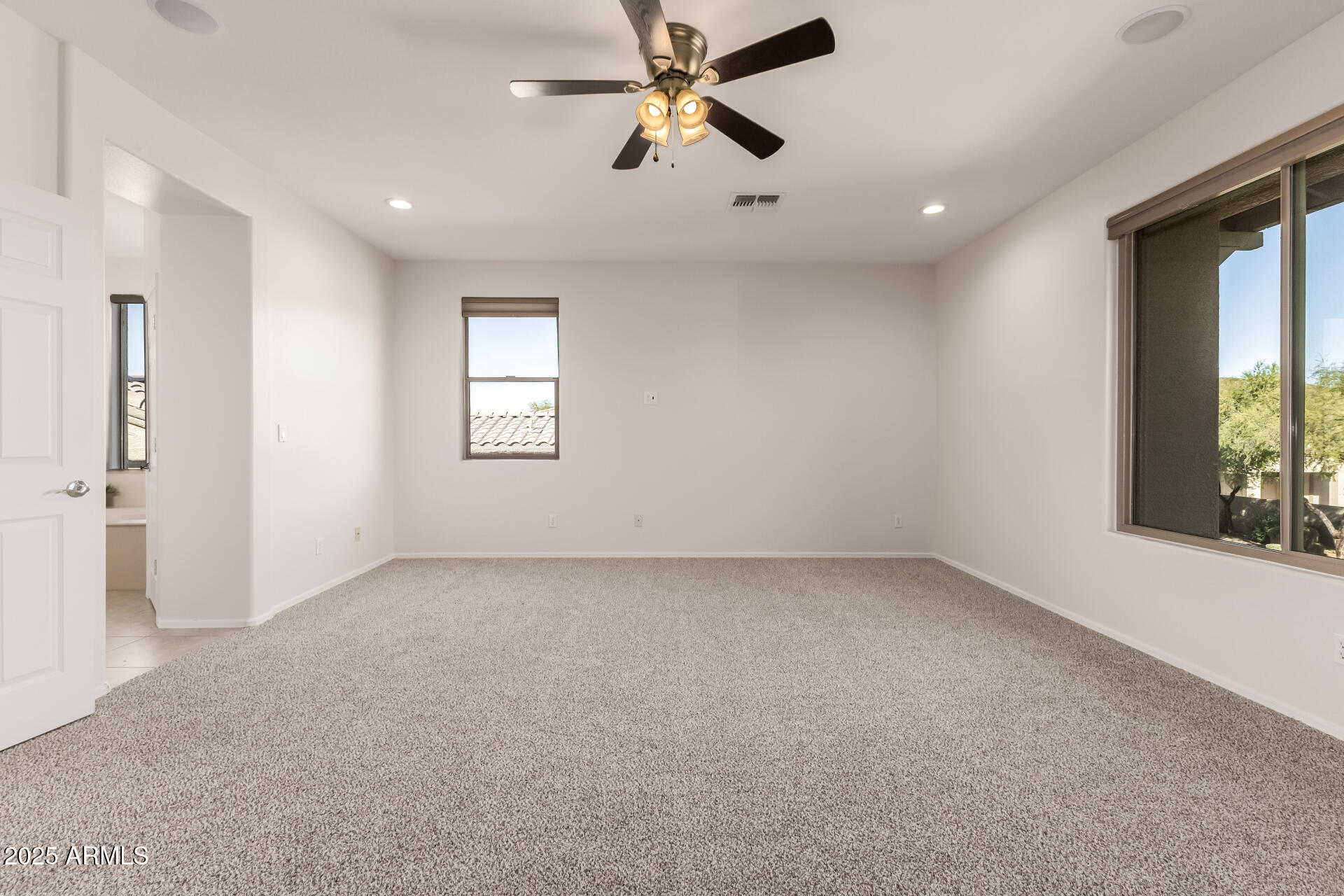 35822 North 33rd Lane Phoenix, AZ 85086 - Photo 25 of 54 an empty room with windows and fan