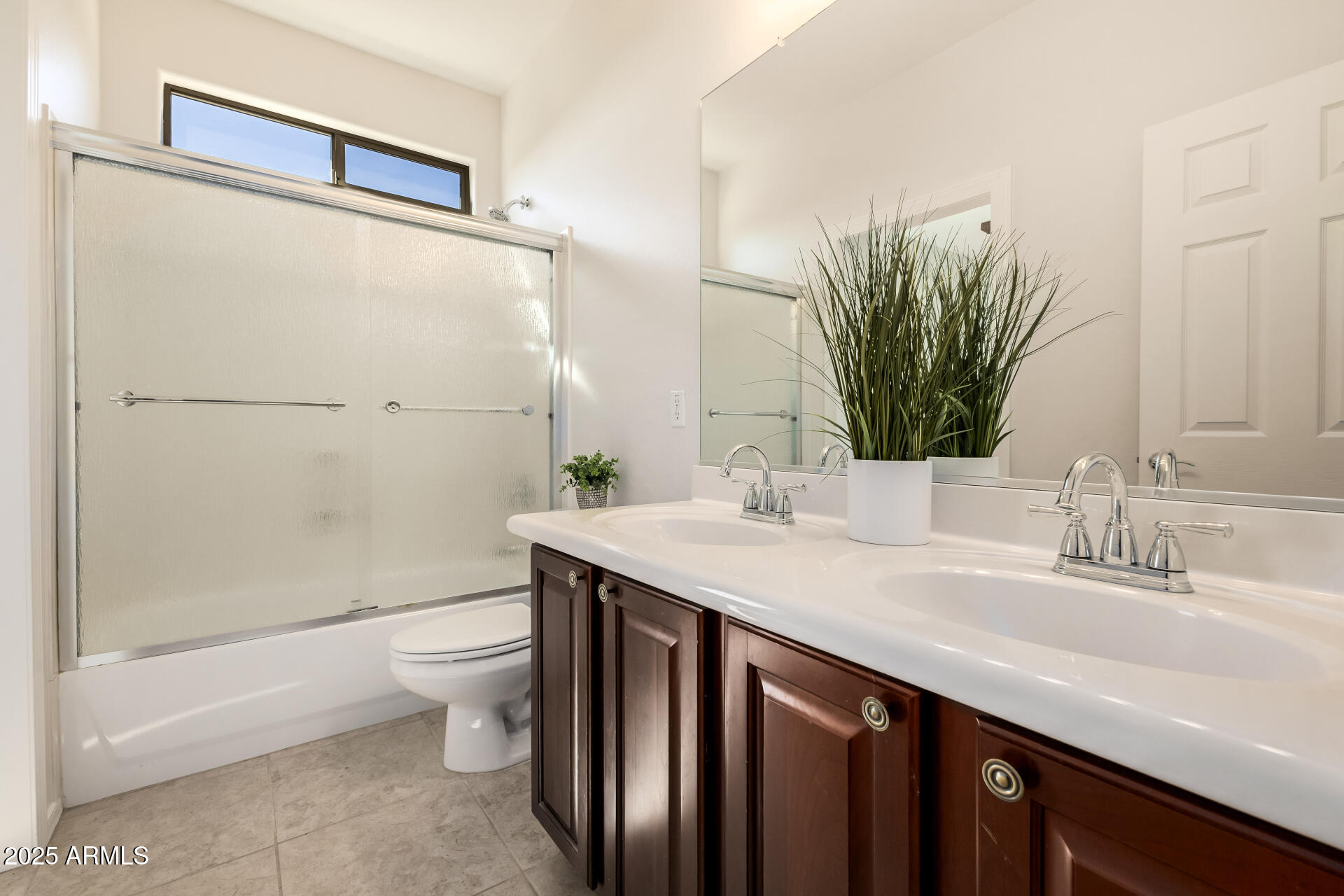 35822 North 33rd Lane Phoenix, AZ 85086 - Photo 35 of 54 a bathroom with a double vanity sink toilet and shower