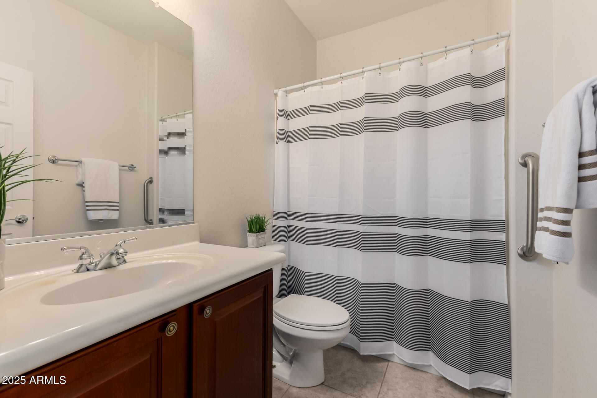 35822 North 33rd Lane Phoenix, AZ 85086 - Photo 44 of 54 a bathroom with a sink a toilet and shower curtain