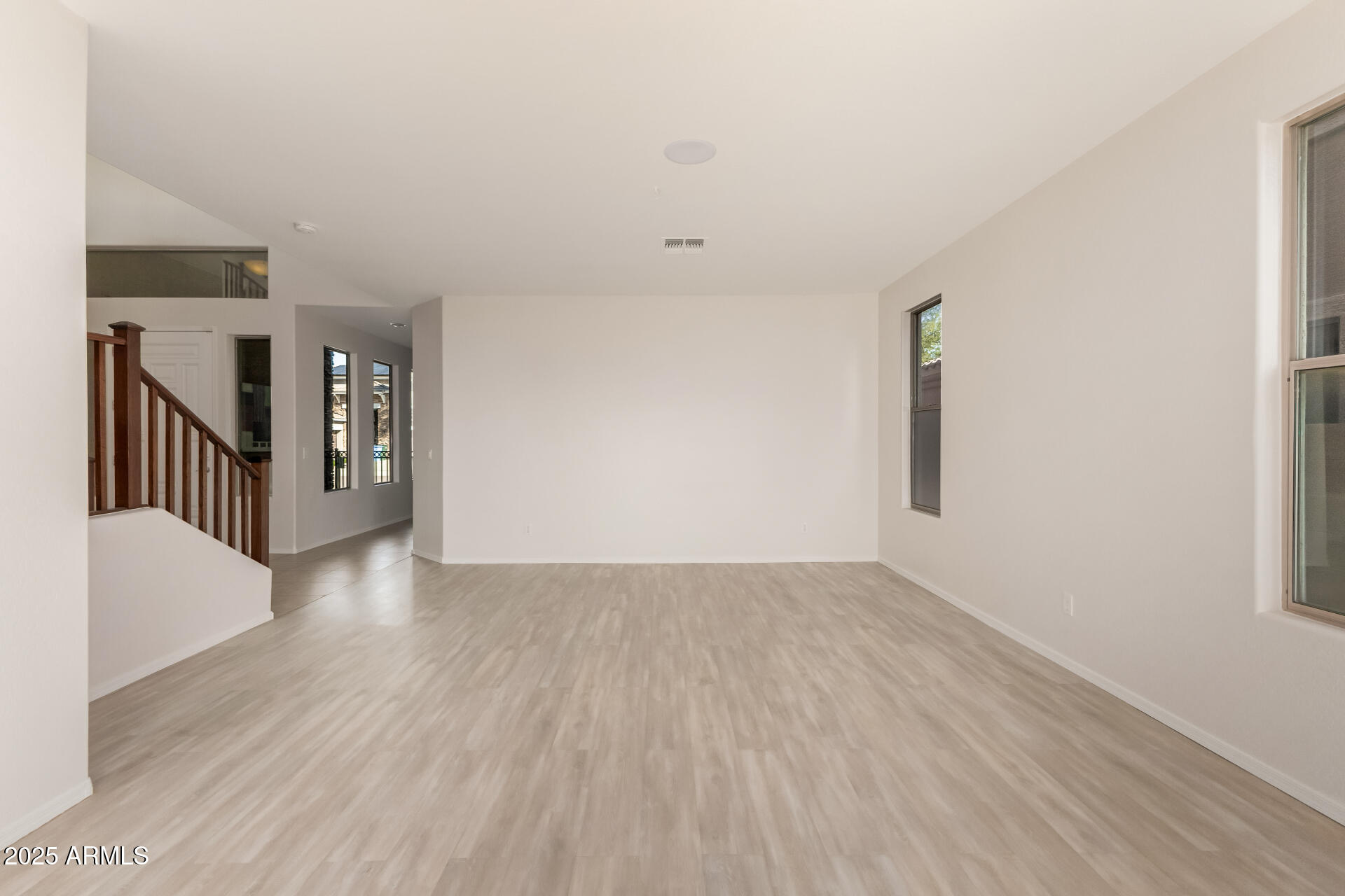 35822 North 33rd Lane Phoenix, AZ 85086 - Photo 9 of 54 a view of an empty room with wooden floor and a window