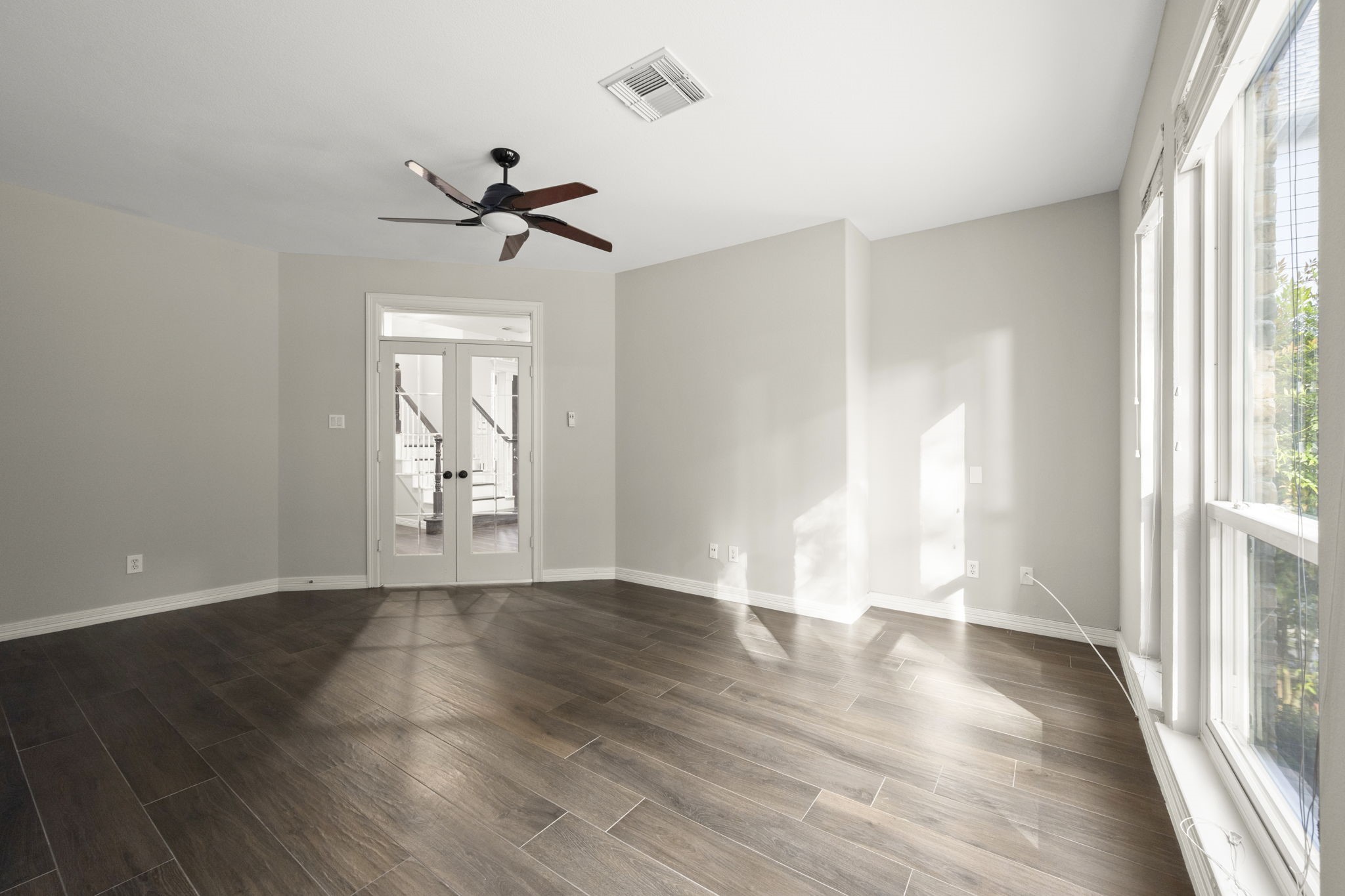 2326 Timbergreen Circle Magnolia, TX 77355 - Photo 23 of 43 wooden floor in an empty room with a window