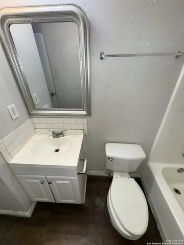 a bathroom with a toilet and a sink