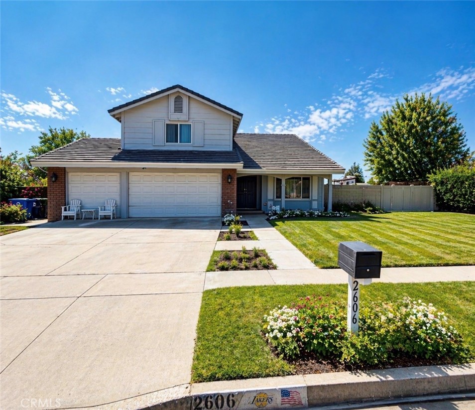 2606 North Palm Avenue Rialto, CA 92377 - Photo 1 of 29 a front view of a house with a yard