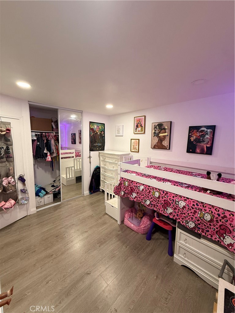 2606 North Palm Avenue Rialto, CA 92377 - Photo 13 of 29 a spacious bedroom with a bed and a window