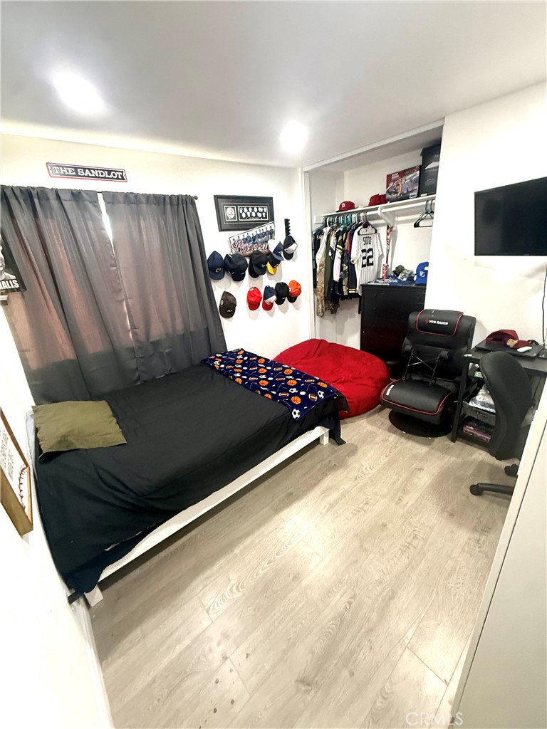 2606 North Palm Avenue Rialto, CA 92377 - Photo 14 of 29 a bed room with a bed and a television