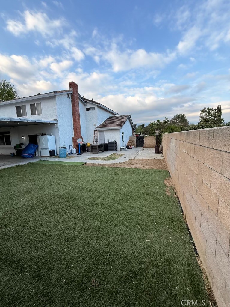 2606 North Palm Avenue Rialto, CA 92377 - Photo 18 of 29 a view of a house with a yard and sitting area