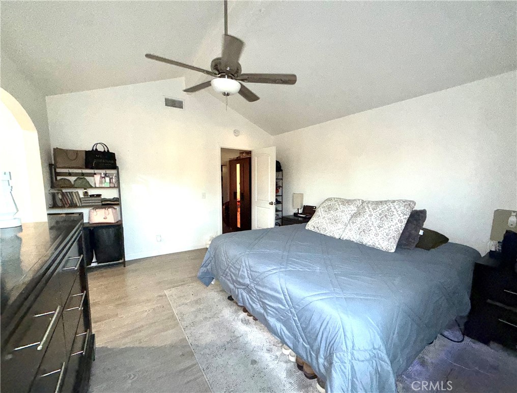 2606 North Palm Avenue Rialto, CA 92377 - Photo 2 of 29 a large bedroom with a bed and a flat screen tv