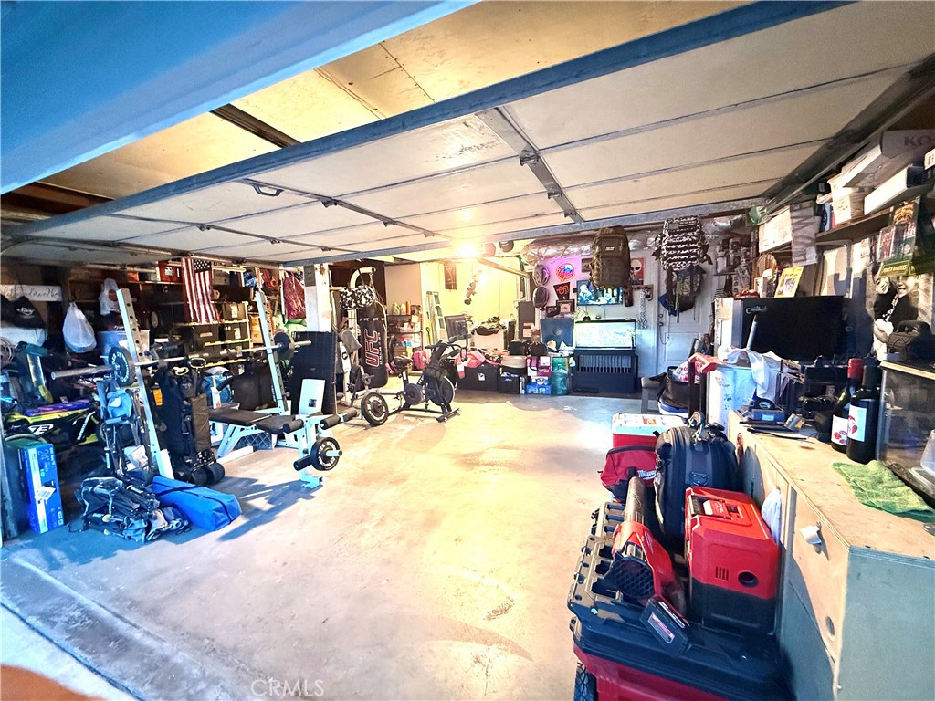 2606 North Palm Avenue Rialto, CA 92377 - Photo 21 of 29 a view of a storage room with a table and chairs