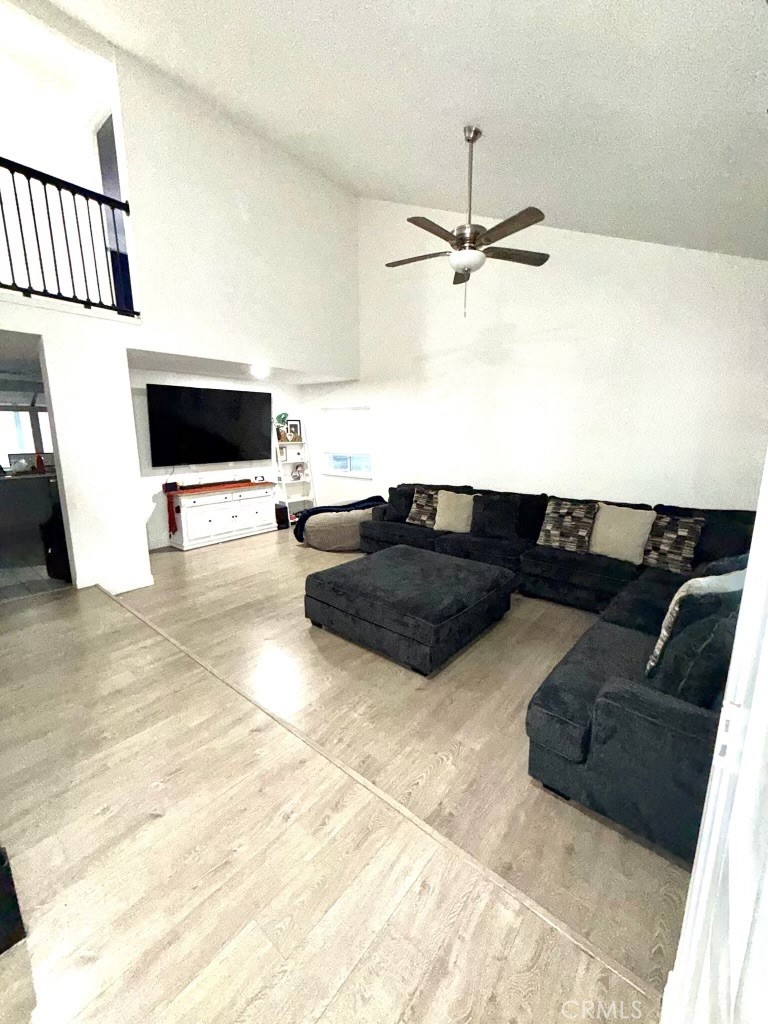 2606 North Palm Avenue Rialto, CA 92377 - Photo 28 of 29 a living room with furniture and a flat screen tv