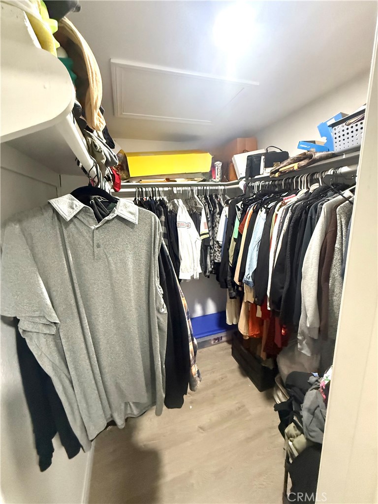2606 North Palm Avenue Rialto, CA 92377 - Photo 5 of 29 a view of walk in closet with clothes and shoes