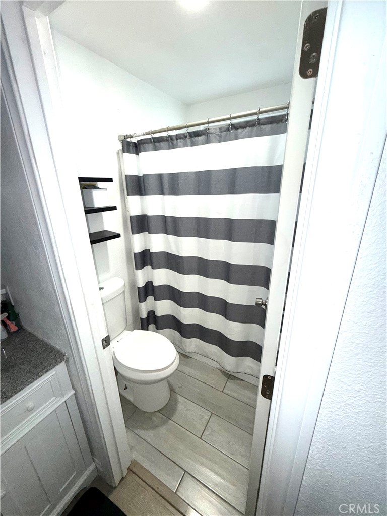 2606 North Palm Avenue Rialto, CA 92377 - Photo 6 of 29 a bathroom with a sink and a toilet