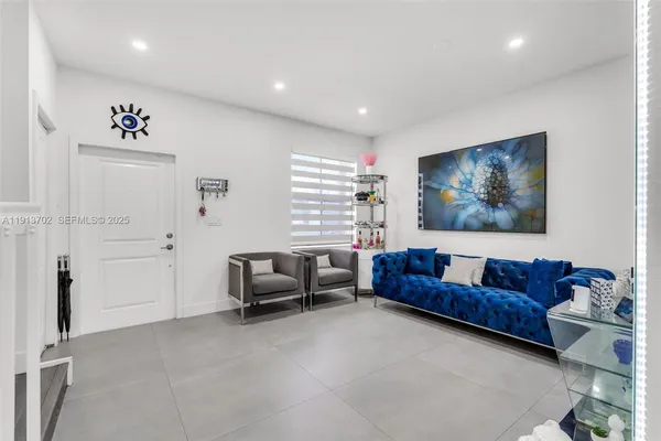 a living room with furniture and a window