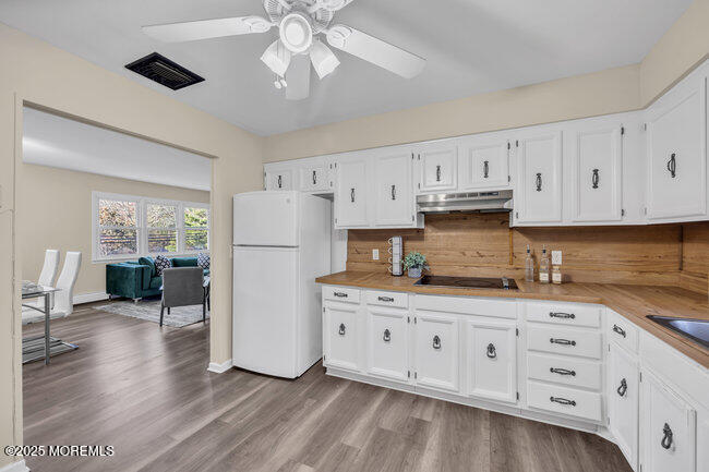 153 Cedar Swamp Road Jackson, NJ 08527 - Photo 11 of 21 a kitchen with granite countertop white cabinets and white appliances