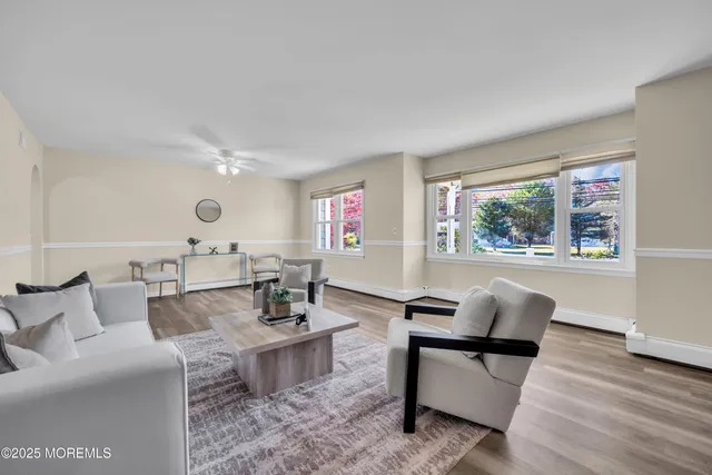 a living room with furniture and a table