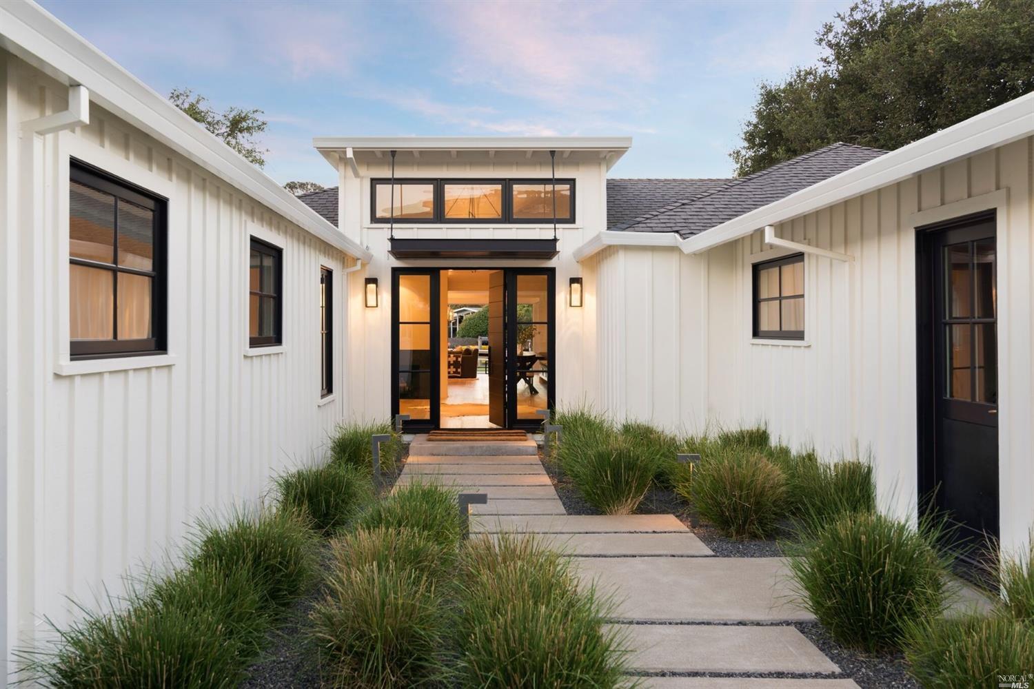 a front view of a house with garden