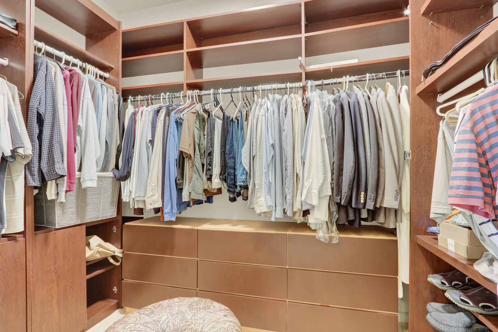 7349 Carmela Way Delray Beach, FL 33446 - Photo 27 of 82 a view of walk in closet with clothes and shoes