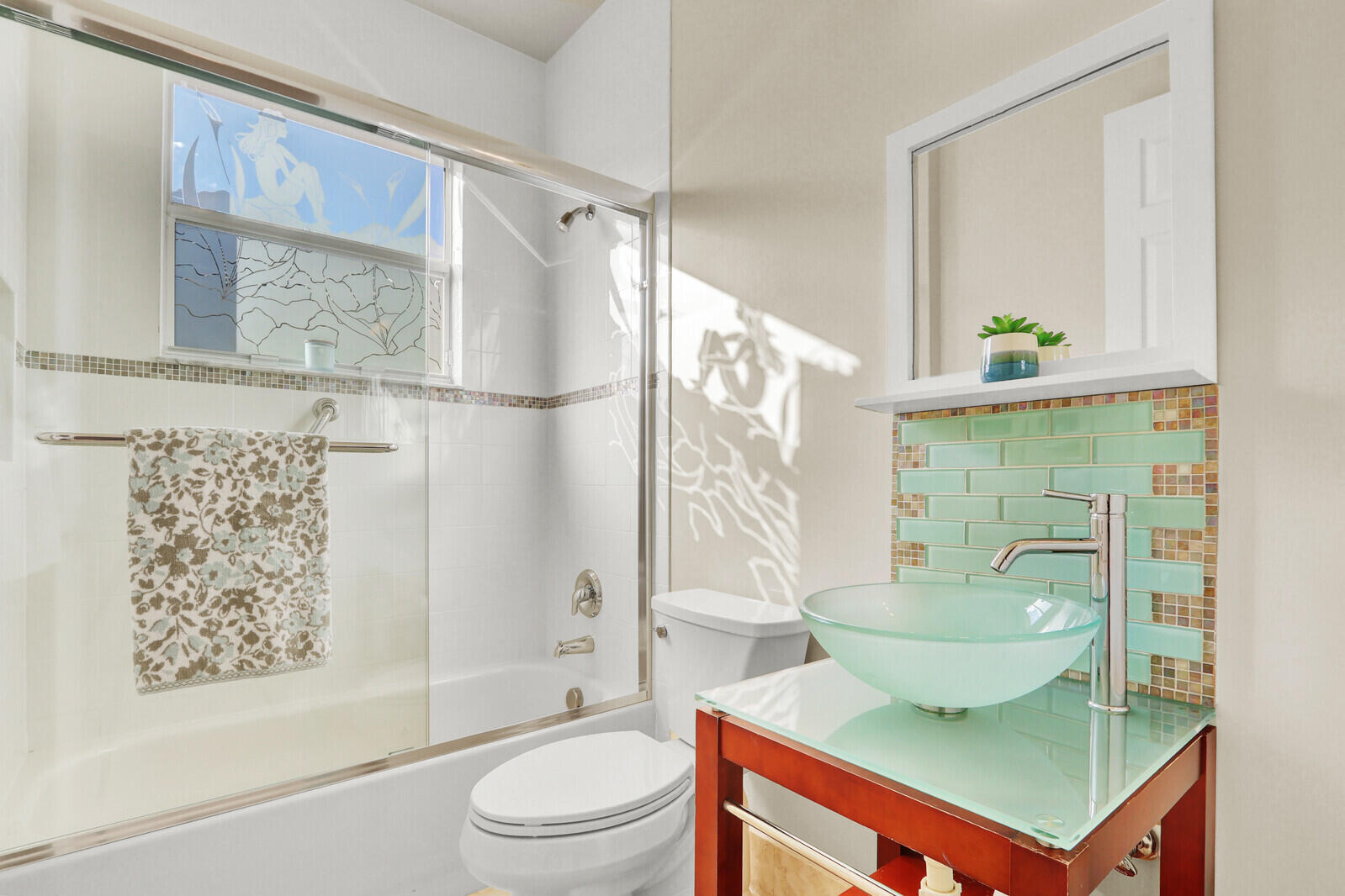 7349 Carmela Way Delray Beach, FL 33446 - Photo 34 of 82 a bathroom with a shower a sink and a mirror