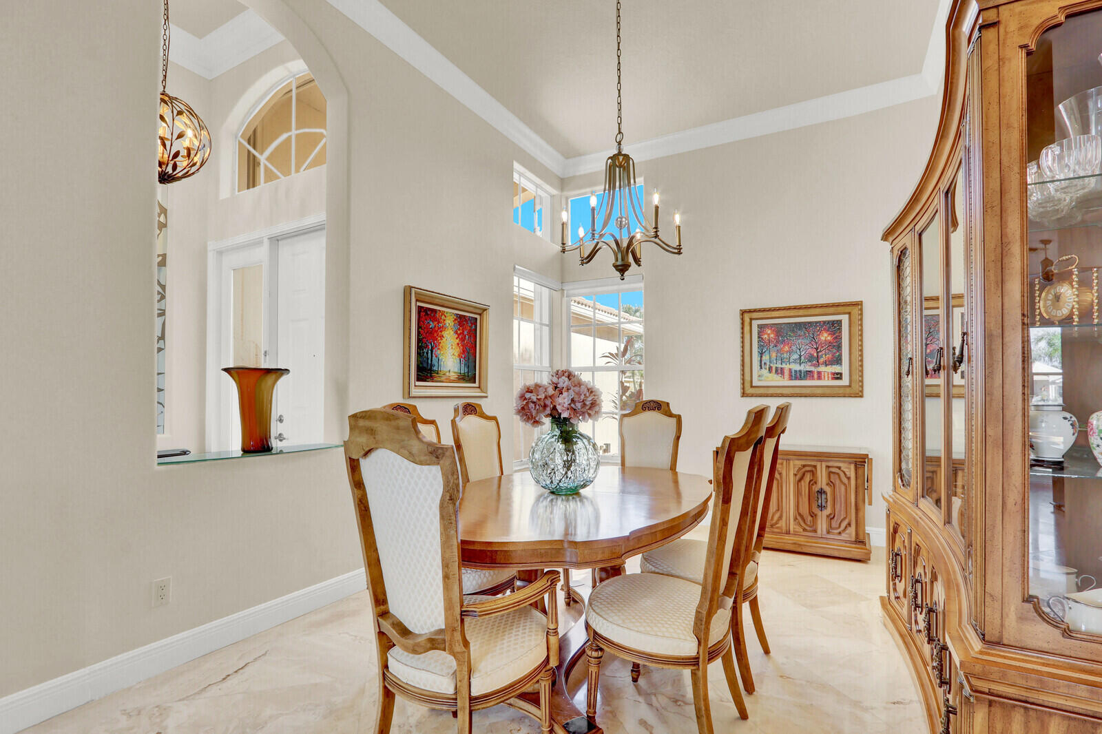 7349 Carmela Way Delray Beach, FL 33446 - Photo 10 of 82 a dining room with furniture and chandelier