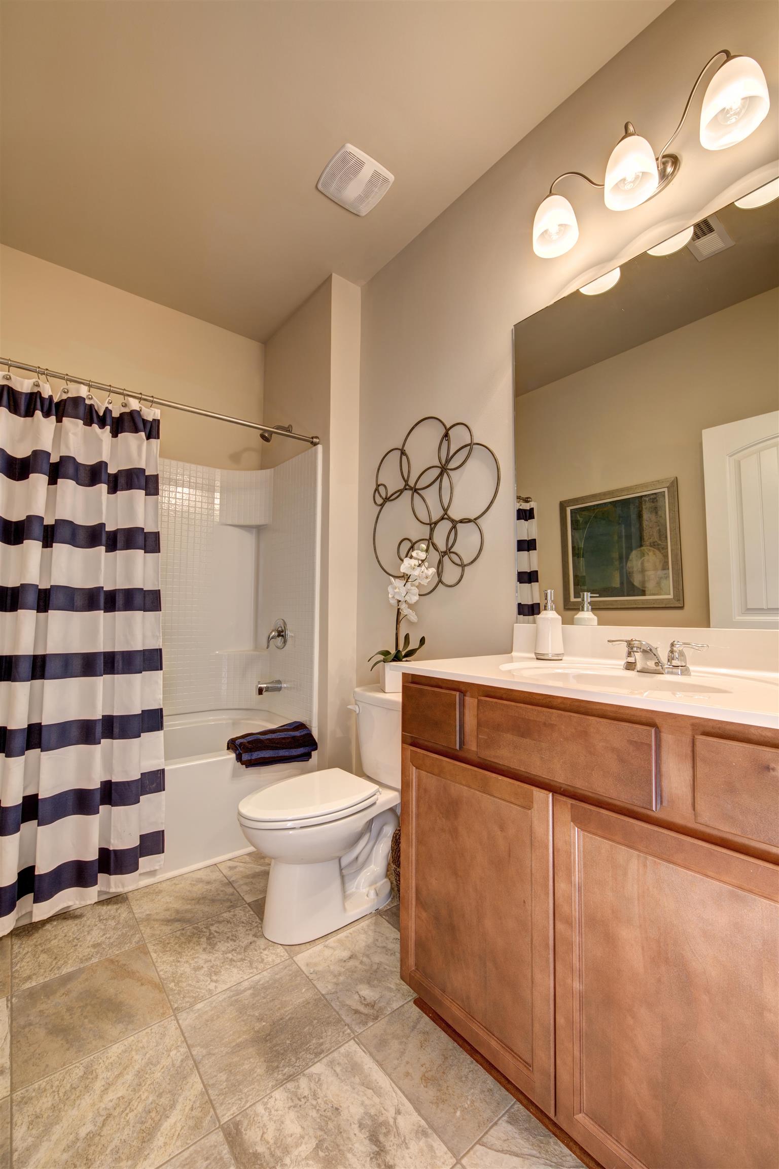 743 Prominence Road, Unit 97 Columbia, TN 38401 - Photo 6 of 23 a bathroom with a sink toilet and shower