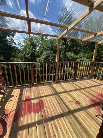 a view of balcony with wooden floor