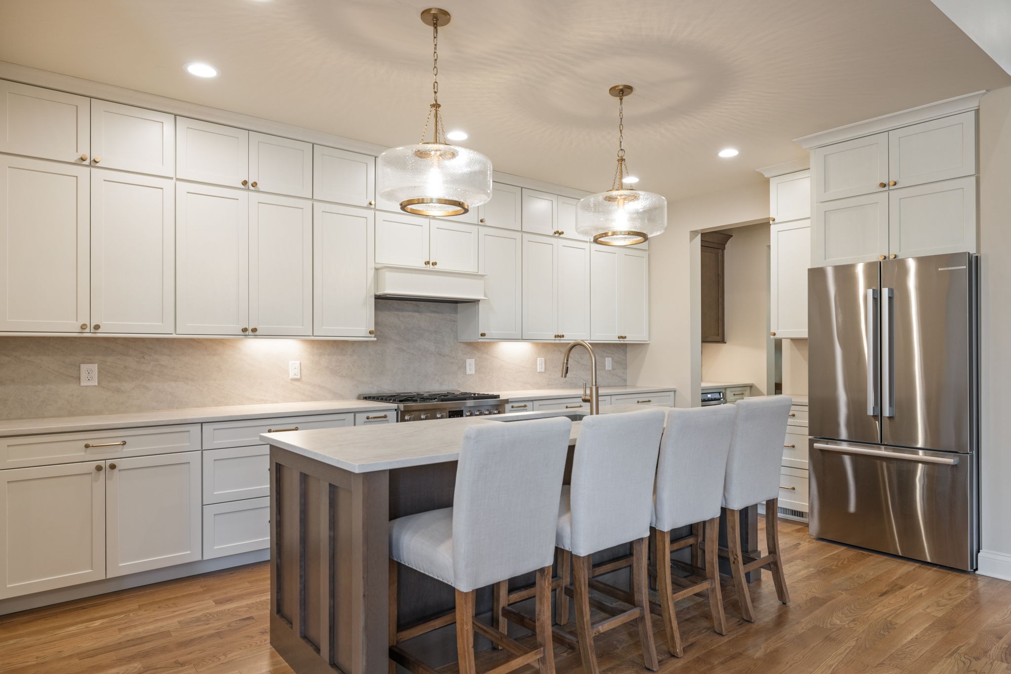 128 Addison Avenue Franklin, TN 37064 - Photo 27 of 81 a kitchen with stainless steel appliances granite countertop a sink a stove a refrigerator and white cabinets