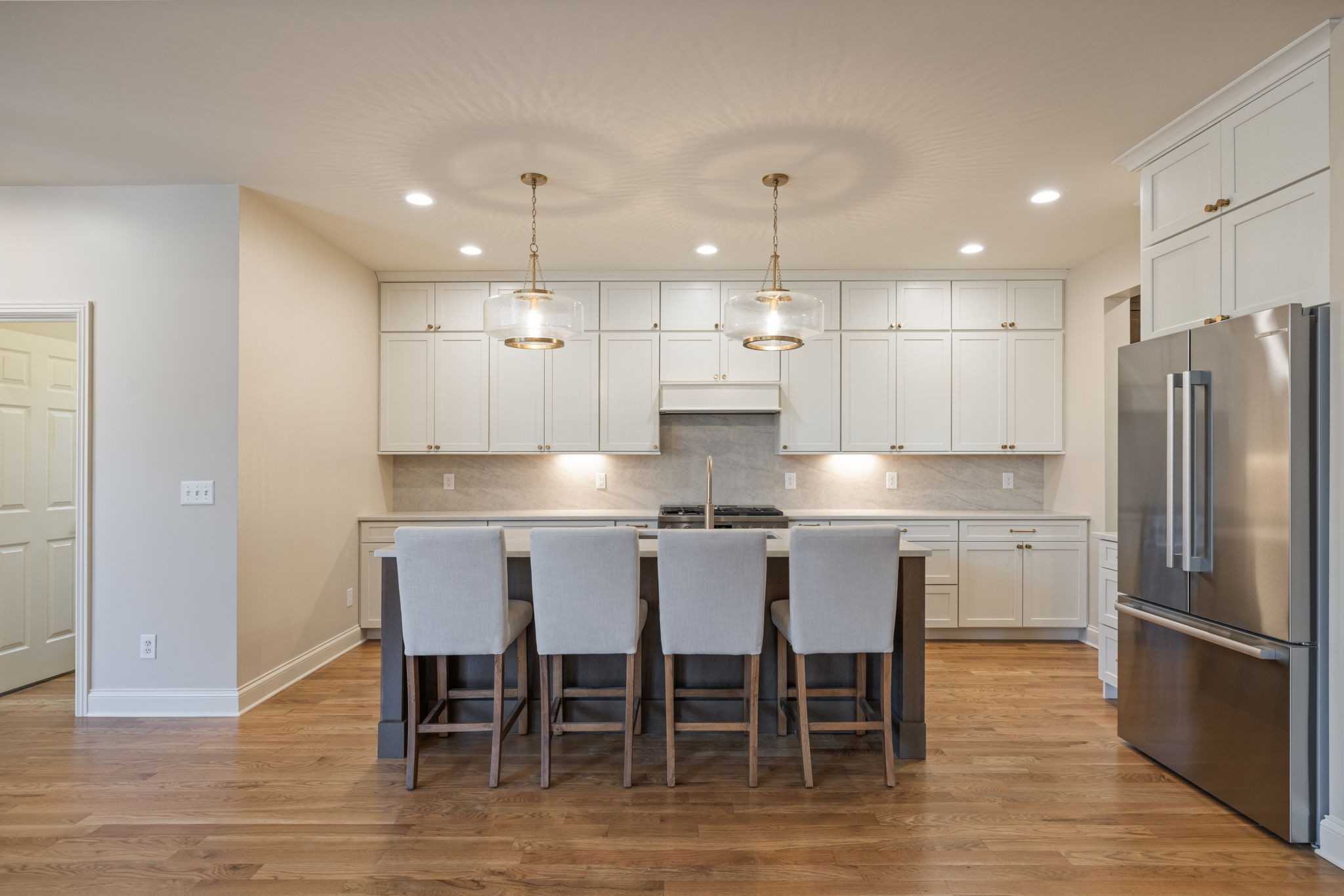 128 Addison Avenue Franklin, TN 37064 - Photo 28 of 81 a kitchen with a dining table chairs refrigerator and cabinets