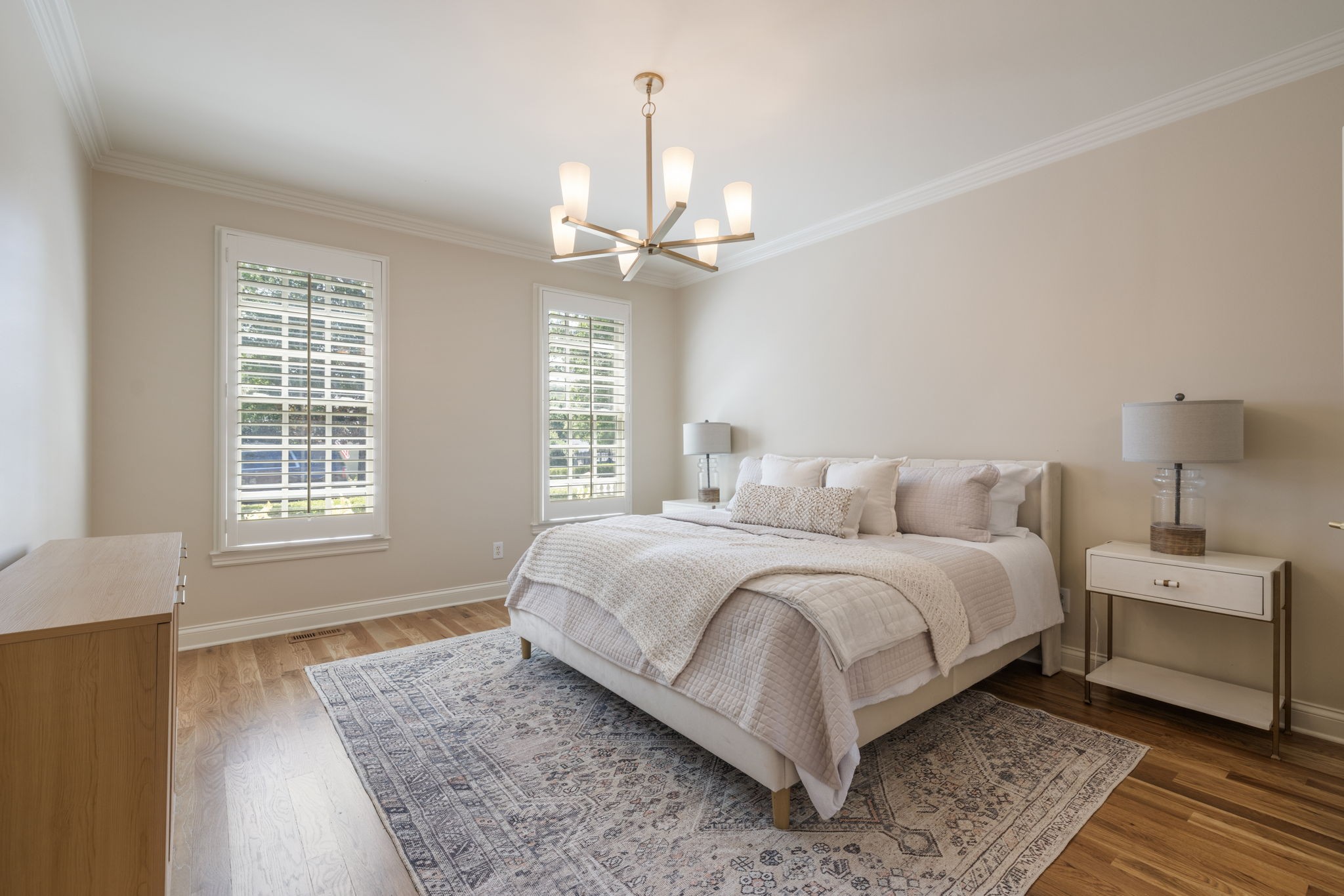 128 Addison Avenue Franklin, TN 37064 - Photo 38 of 81 a spacious bedroom with a bed and a chandelier