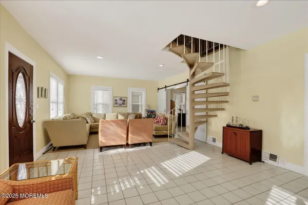 a living room with furniture and a painting