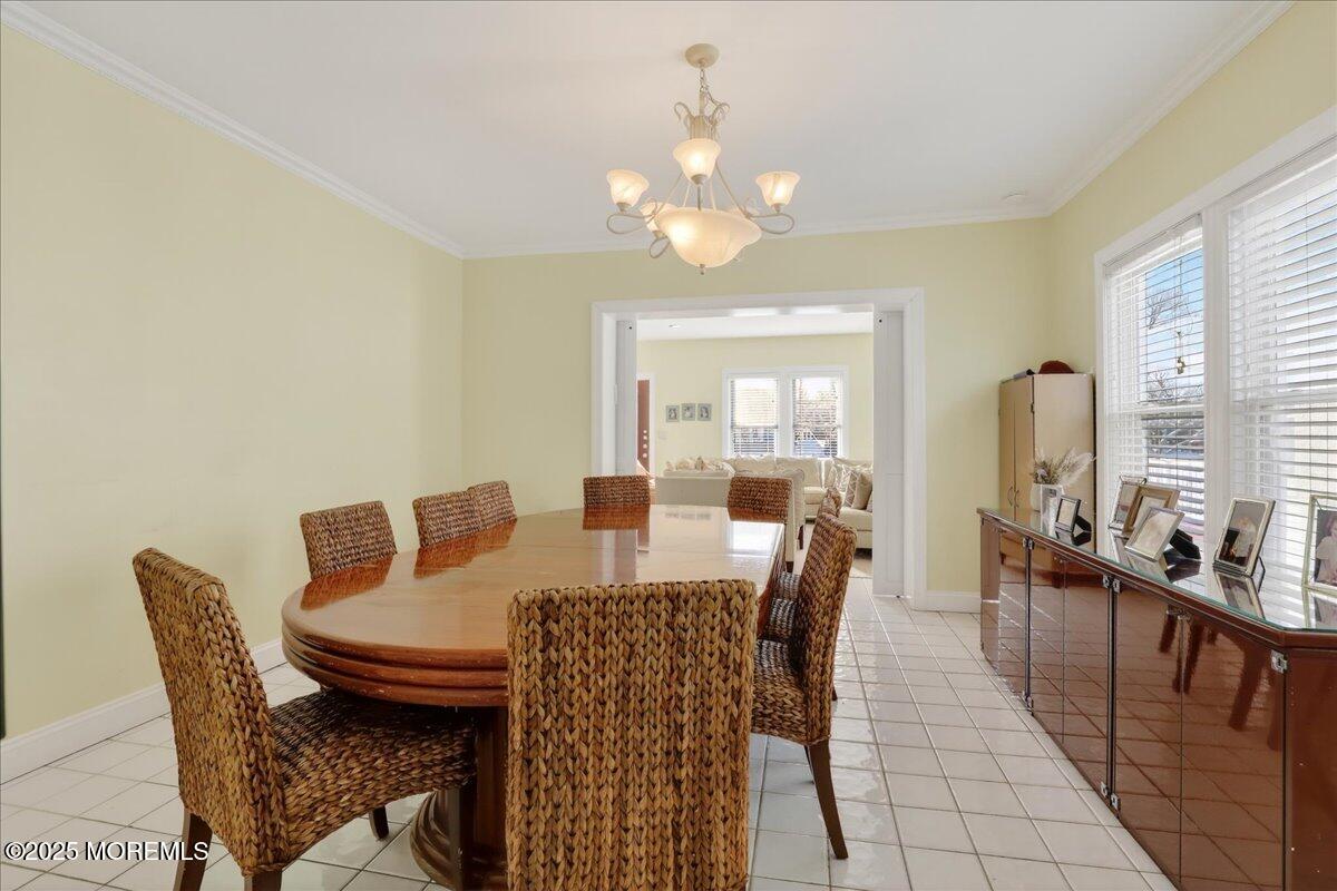 57 Hathaway Avenue Deal, NJ 07723 - Photo 20 of 37 a view of a dining room with furniture and a chandelier