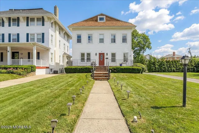 a front view of a building with garden