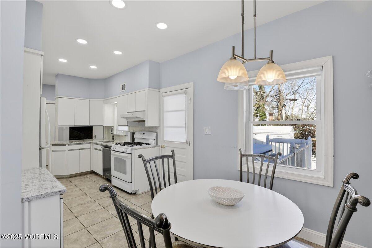 57 Hathaway Avenue Deal, NJ 07723 - Photo 26 of 37 a kitchen that has a table chairs and wooden floor