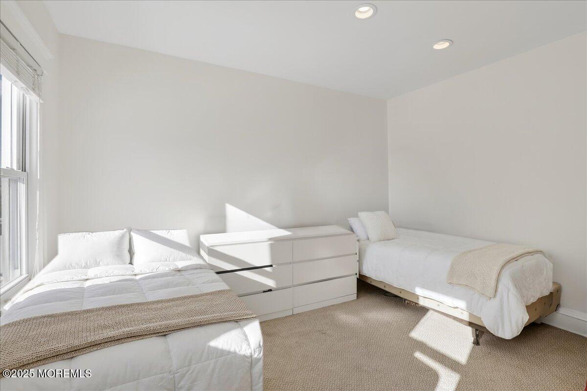 57 Hathaway Avenue Deal, NJ 07723 - Photo 35 of 37 a bedroom with a bed and a couch