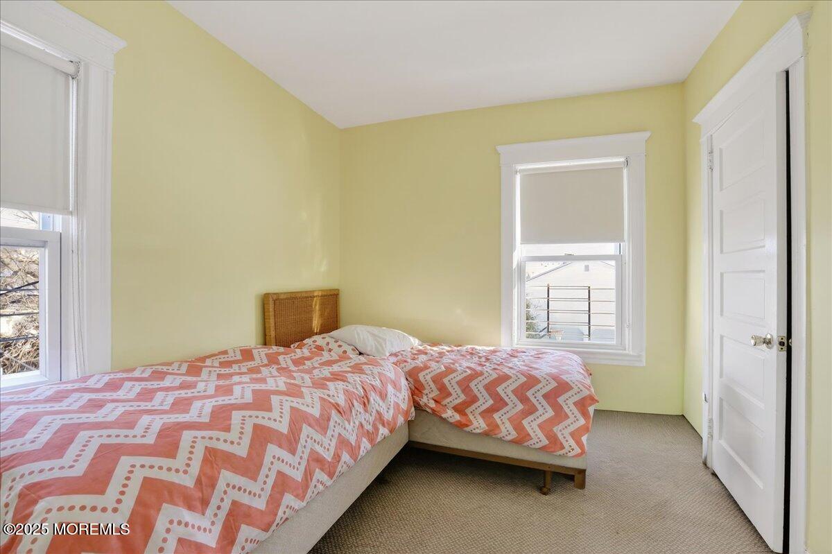 57 Hathaway Avenue Deal, NJ 07723 - Photo 8 of 37 a bedroom with a bed and a window