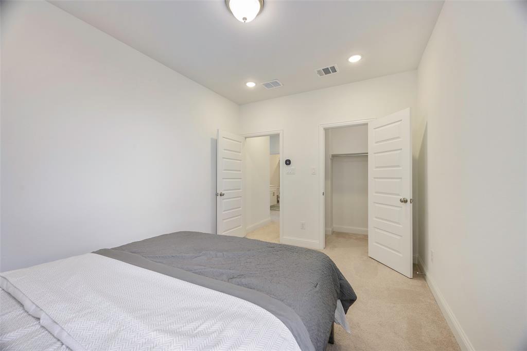 3603 Scotsman Road Sachse, TX 75048 - Photo 19 of 33 a bedroom with a bed and a shower