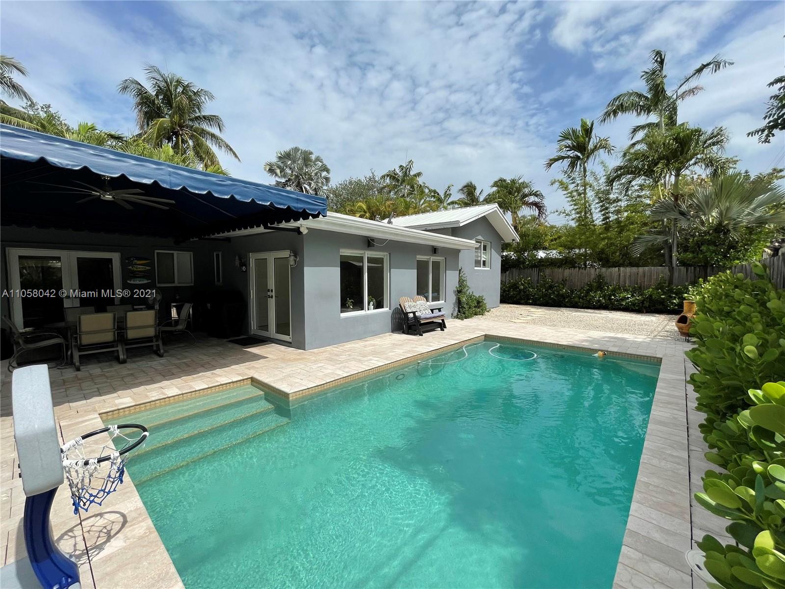 265 Glenridge Road Key Biscayne, FL 33149 - Photo 23 of 23 a view of a house with swimming pool and a porch