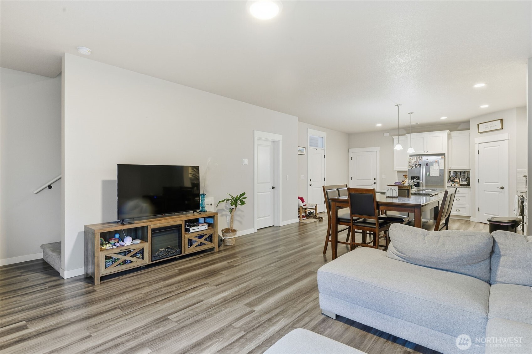 7109 South Ridge Way Ridgefield, WA 98642 - Photo 11 of 25 a living room with furniture and a flat screen tv