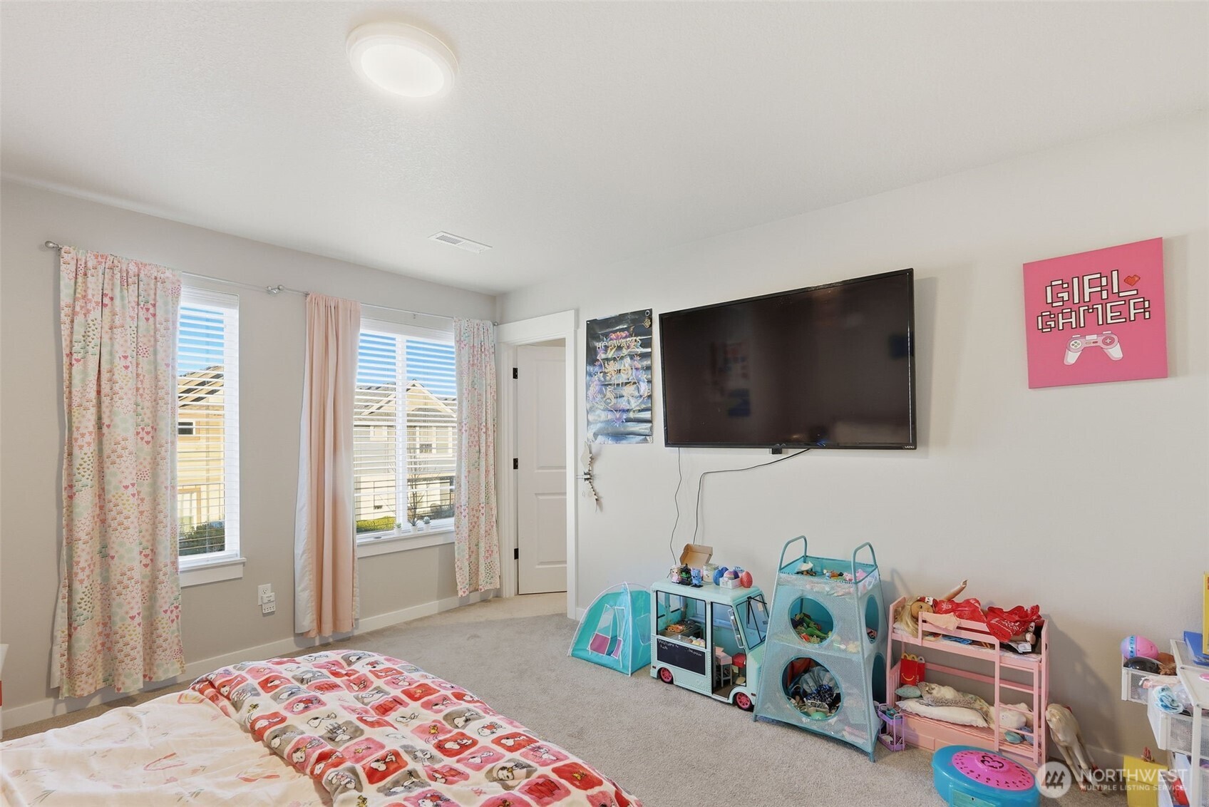 7109 South Ridge Way Ridgefield, WA 98642 - Photo 22 of 25 a bedroom with a bed and a flat screen tv