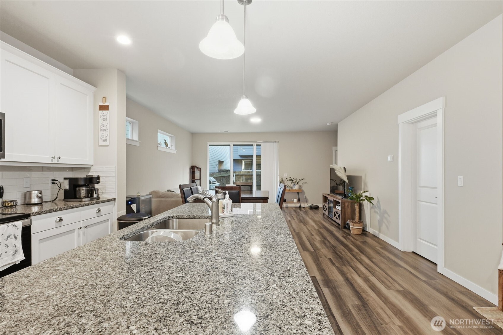 7109 South Ridge Way Ridgefield, WA 98642 - Photo 8 of 25 a living room with furniture a dining table and chairs with wooden floor